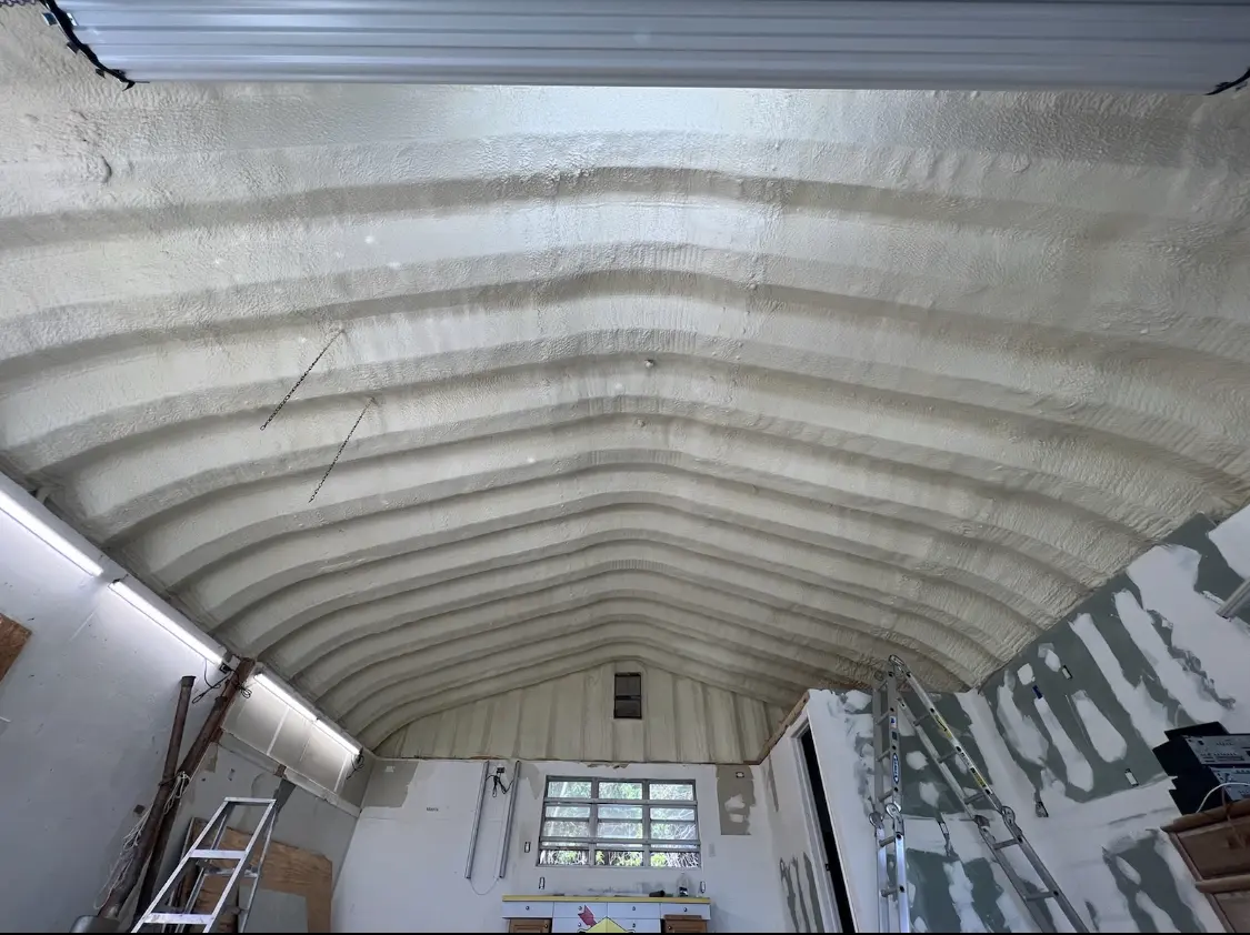Spray polyurethane foam applied to the underside of a metal roof deck in Victoria